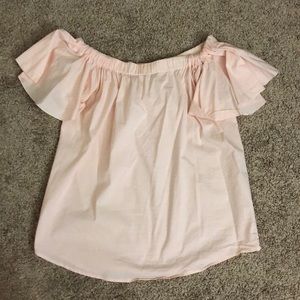 Blush pink flowy off the shoulder crop top.